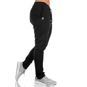Close-up side view of black slim-fit joggers for men's gym fitness and training