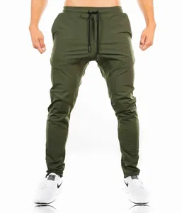 Detailed view of men's olive green slim fit gym joggers featuring articulated knees