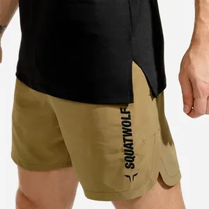 Close-up view showing the brand logo detail on khaki athletic performance shorts