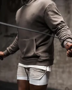 Professional men's athletic double-layer shorts and hoodie set for fitness and running.