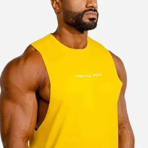 Detail view of yellow slim fit mens fitness tank top with LEAD THE PACK chest print