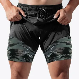 Close-up detail of men's 2-in-1 running shorts featuring a black outer and camo liner