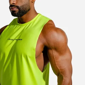 Detail view of a neon green men's muscle tank top showing fit and chest print logo