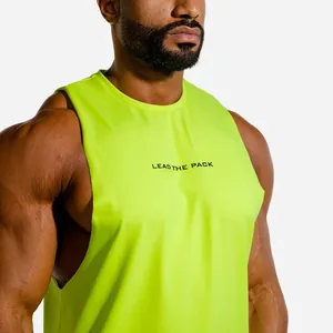 Detail shot of neon green muscle tank top with LEAD THE PACK print on chest.