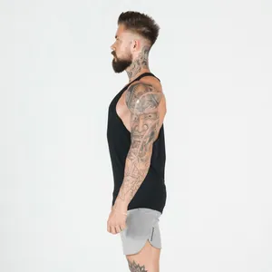 Side view profile of man wearing black breathable stringer vest for gym fitness training