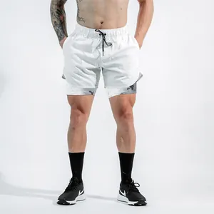 Detailed view of men's white 2-in-1 shorts with camouflage inner lining layer