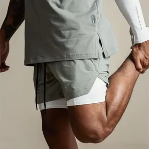 Detail showing the breathable double-layer fabric of men's sage green performance shorts