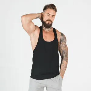 Muscular man wearing a black athletic fitness tank top with a breathable and elastic design