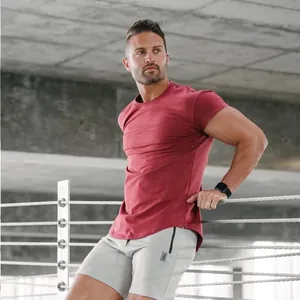 Detailed view of men's slim fit maroon gym t-shirt with crew neck and short sleeves