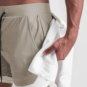 Detail view of men's double-layered sports shorts with functional towel loop
