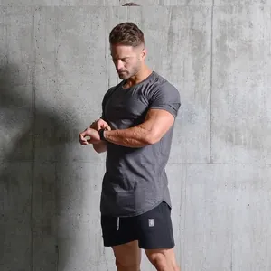 Athletic slim fit men's training t-shirt in charcoal grey shown on muscular model.