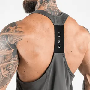 Detailed macro view of a grey fitness tank top with a black elastic GO HARD back strap