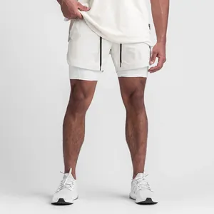Lower body view of white double-layer athletic shorts on model for fit demonstration