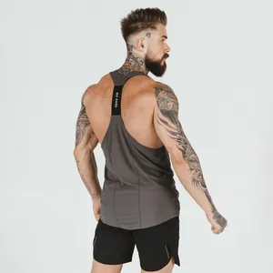 Detailed back view of a grey bodybuilding stringer tank top worn by a muscular model