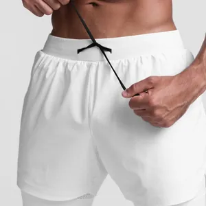 Close-up of white double-layer quick-dry athletic shorts with adjustable black drawstring.