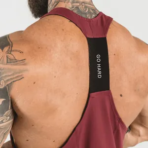 Detailed back view of burgundy gym tank top featuring black GO HARD elastic strap