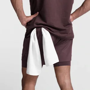 Detail of burgundy men's athletic shorts with functional back towel loop design.