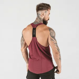 Close-up detail of burgundy men's gym stringer tank top with GO HARD racerback strap