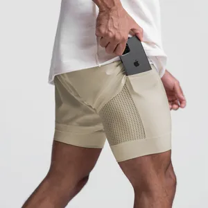 Detailed view of men's double-layer athletic shorts with a hidden side phone pocket