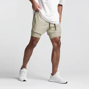 Detail view of men's beige double-layer quick-dry athletic running shorts