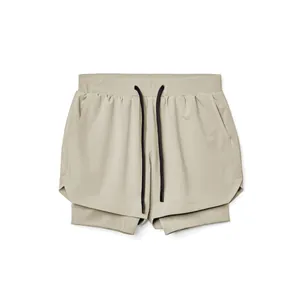 Detailed view of men's double-layer quick-dry athletic shorts in light khaki finish