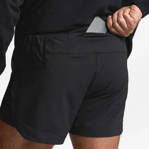 Close-up of men's athletic shorts back pocket with phone or card storage.