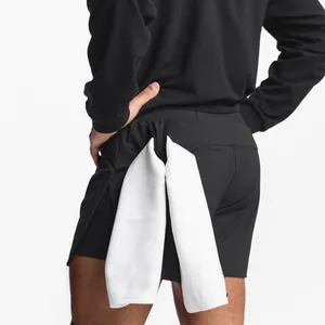 Close-up detail of black men's athletic gym shorts showing functional towel loop