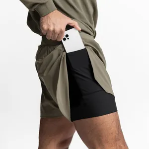Close-up view of olive 2-in-1 athletic shorts with a functional hidden phone pocket liner