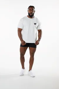 Full macro view of white men's athletic t-shirt showing crew neck and chest logo detail