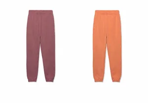 Detailed view of men's cotton sweatpants in purplish red and orange colors
