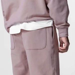 Detail shot of mauve men's tracksuit showing high-quality cotton fabric and stitching
