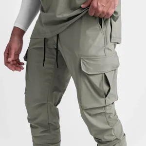 Detail shot of men's slim-fit woven cargo joggers featuring a side utility pocket.
