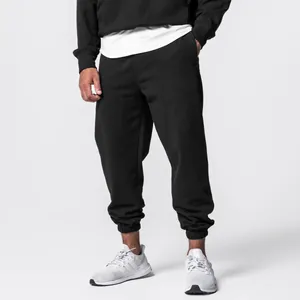 Detail shot of men's loose black hooded sweatshirt and sweatpants set for sports