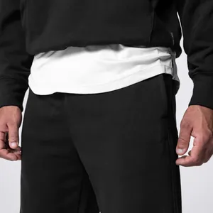Close-up detail of 320g heavyweight cotton men's loose-fit black sweatpants fabric