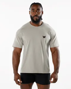 Front view of a gray men's sports fitness crew neck t-shirt on a muscular male model.