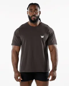 Close-up of men's charcoal grey athletic fitness t-shirt with a white winged chest logo