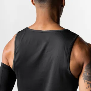 Close-up of black breathable mesh fabric on men's athletic tank top back view.