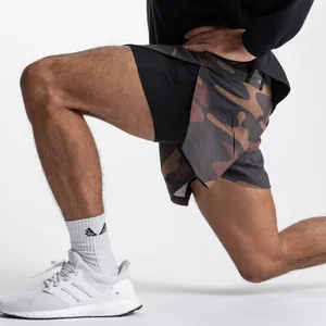 Detail view of men's 2-in-1 camo fitness shorts for gym training and running