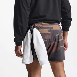 Detail view of camo sports shorts for men featuring a functional towel loop on the waistband.