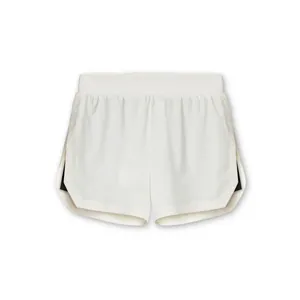 Detailed view of white athletic training shorts with breathable mesh and side slits