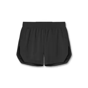 Close-up detail of black men's athletic gym shorts with side slit and elastic waist