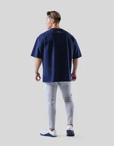 Back view of men's navy blue oversized gym sports T-shirt featuring minimalist logo