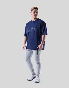 Professional full-body view of an oversized navy blue fitness gym T-shirt for men