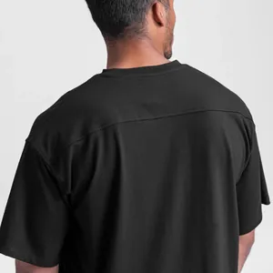 Macro view of black cotton sports T-shirt back featuring shoulder yoke detail