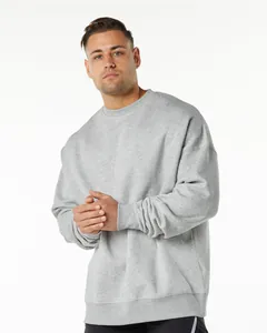 Detailed studio view of a men's oversized grey crewneck sweatshirt with drop shoulders