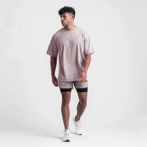 Oversized men's mauve athletic T-shirt featuring a split hem and matching shorts