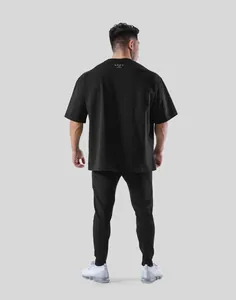 Professional back view of men's oversized black fitness T-shirt with LYFT logo