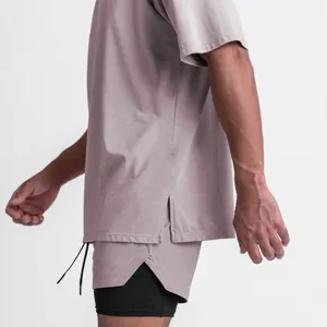 Side view detail of a men's loose athletic T-shirt with hem side slit and shorts