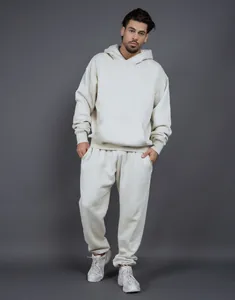 Model wearing a premium cream oversized heavy fleece hoodie and sweatpants set.