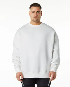 Professional studio shot of a model wearing a heavy white oversized crewneck sweatshirt